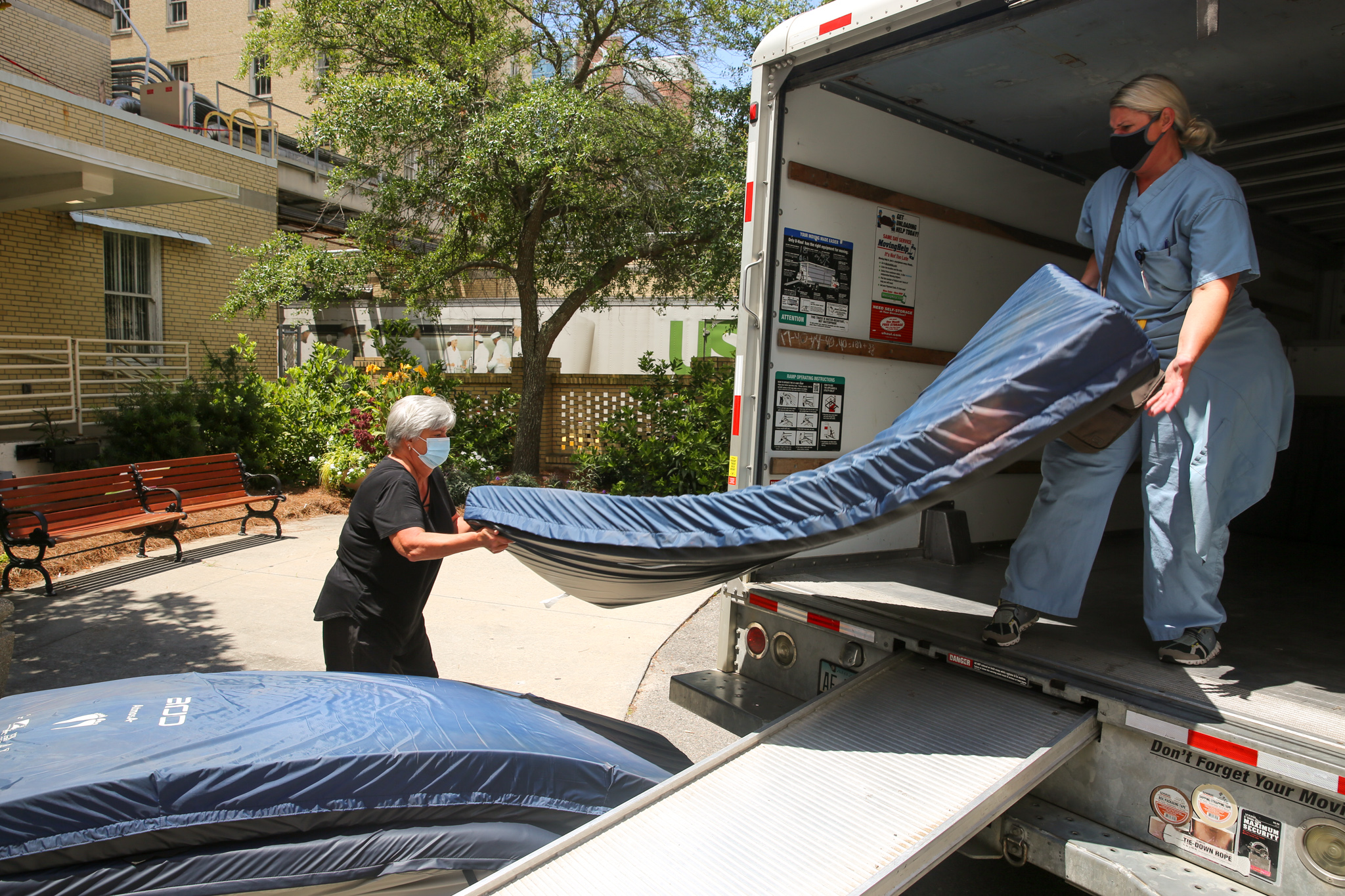 workers loading beds